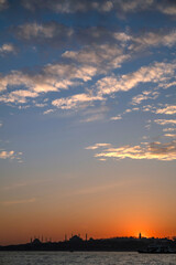 Stunning Istanbul skyline at sunset looking across the Bosphorous Strait.