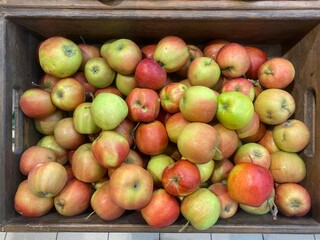 Apples in a box on sale. Apples on the counter at the store
