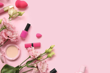 Composition with makeup products, nail polish and flowers on pink background