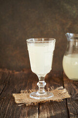 Fresh natural whey in a glass cup - protein rich healthy nutritional supplement