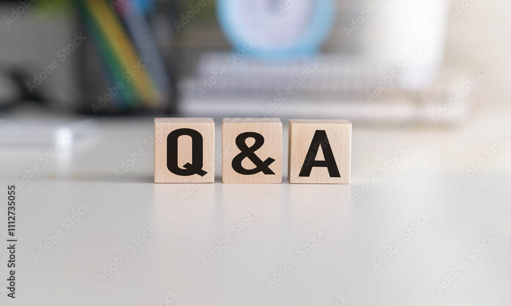 Poster q and a - an abbreviation of wooden blocks with letters on a gray background. reflection of the q an