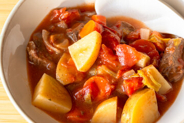 stew with vegetables and spices closeup