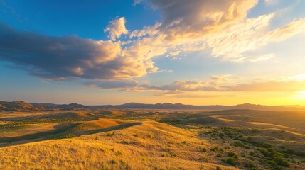 A stunning sunset over rolling hills, with golden grasses and a colorful sky filled with soft clouds, creating a serene landscape.