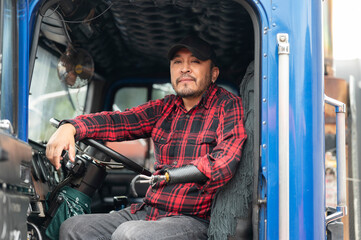 Portrait of a truck driver with a prosthetic arm