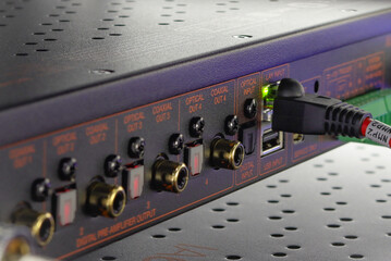 Connecting multimedia equipment in a telecommunications rack.