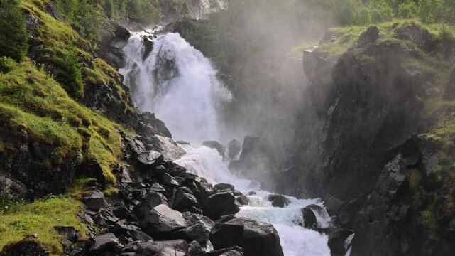 Scenic Latefossen twin waterfall, Norway. Idyllic cascade in Scandinavia nature, lush green landscape. Slow Motion in 4K.