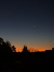 the moon shining in the sunrise