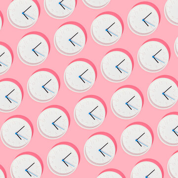 Seamless Pattern of Clocks on Pink Background
