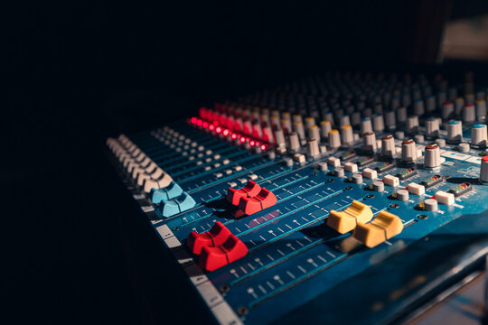 Audio Mixing Console With Colorful Controls in Studio Light