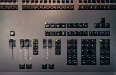 Control panel with buttons and faders for professional audio experience
