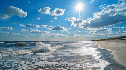 Beautiful sunny beach with gentle waves and bright blue sky.