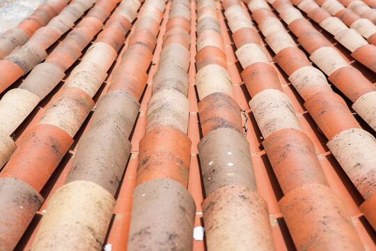 Close-up of traditional clay roof tiles in warm sunlight
