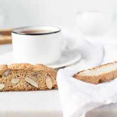 almond biscotti on white marble countertop, almond cantucci cookies on a white board, slices of biscotti cookies or twice baked cookies