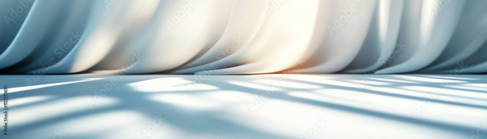 Poster soft flowing curtains with gentle light creating serene shadows on the floor.