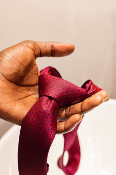 Suit tie in hand
