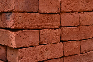 Close up angle view of the stacked fresh bricks