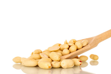 Roasted peanuts with wooden spoon, close-up, isolated on white background.
