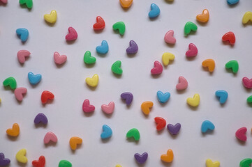 small multi colored hearts on white background