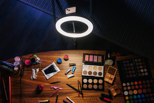 A tabletop filled with various makeup items