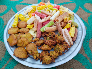 Ramadan special Various dishes on the Mat of Indian Muslims to break the fast. snaks and food, Ramadan iftar Eid. Muslim family has dinner at home.