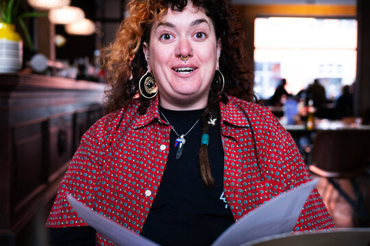Young woman astonished about the menu 