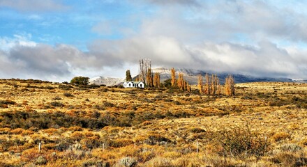 House in the pampas autumn landscape in southern Patagonia, Argentina.