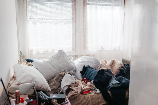 pile of a stuff on a bed