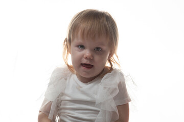 Naklejka premium Portrait of a little girl on a white background.