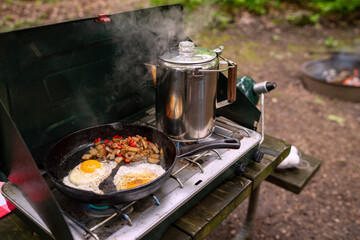 Camping stove with breakfast and coffee pot
