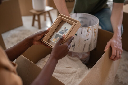 Woman looking at her photo while relocating