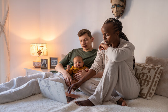 Parents discussing which cartoon to show to baby