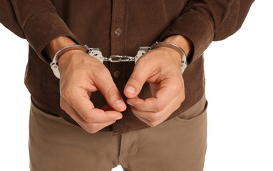 Man in metal handcuffs on white background, closeup