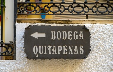 Old metal sign indicating a direction