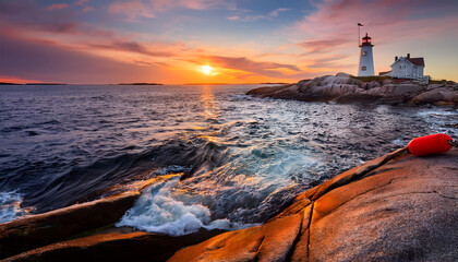 At Peggy’s Cove in Nova Scotia, a vibrant sunset casts warm hues across the sky