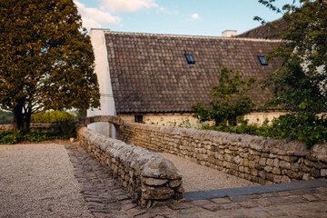 Historic stone wall and roofed building