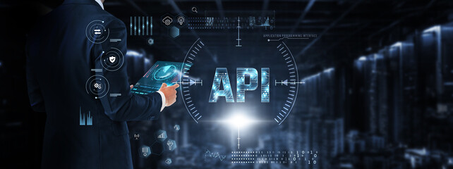 API (Application Programming Interface): Businessman control and monitoring API technology system on digital screen. Integration, automation, data exchange, security, performance optimization.