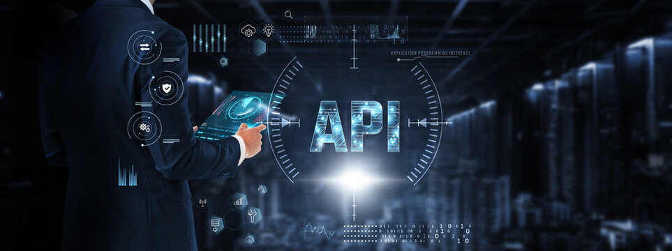 API (Application Programming Interface): Businessman control and monitoring API technology system on digital screen. Integration, automation, data exchange, security, performance optimization.