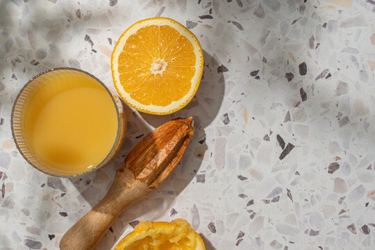 Orange juice and squeezer on a table
