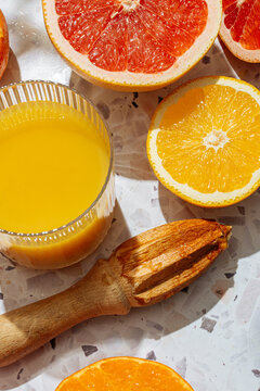 Orange juice and squeezer on a table
