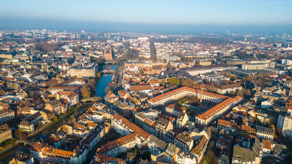 Strasbourg, the capital of Christmas, sparkles during Advent, with its stunning decorations and festive ambiance. This aerial view features the majestic Strasbourg Cathedral, La Petite France 