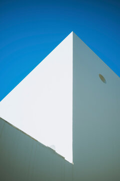 Minimalist White Building Against a Clear Blue Sky