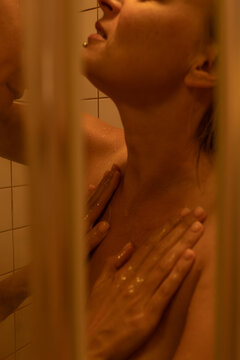 A woman is being washed in a shower
