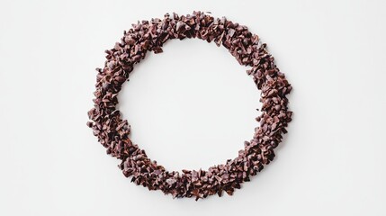 A circle made out of chocolate chips on a white surface