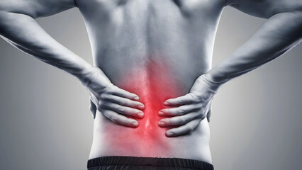 Naklejka premium Grayscale Image Highlighting Lower Back Pain with Red Marked Area and Muscular Upper Back