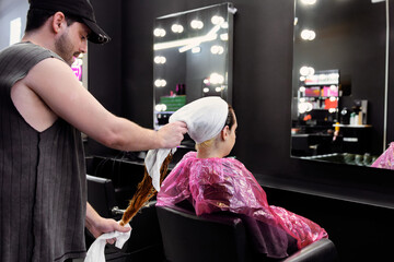 Professional hair treatment session in modern salon environment