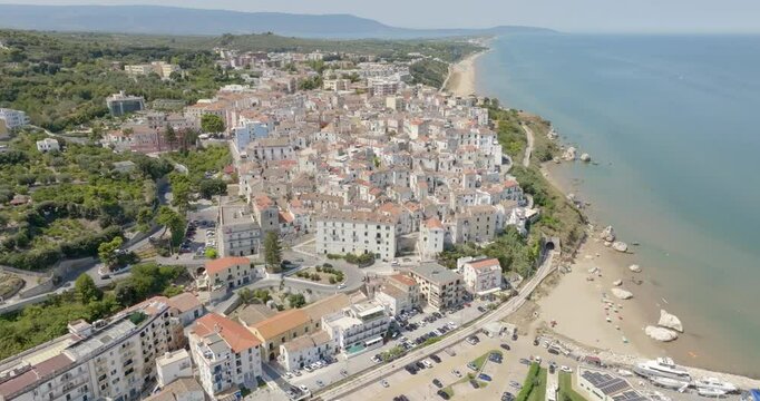 Panoramic aerial view of Rodi Garganico in Puglia, Italy. It is a tourist destination in Gargano, in the province of Foggia. In the background is the Varano lake.