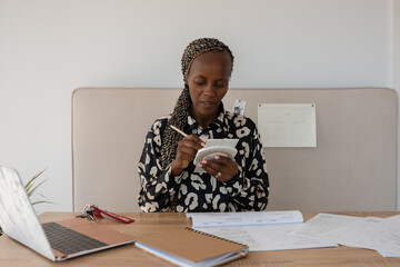Woman practicing using slide rule device