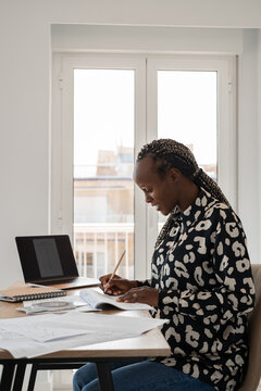 Excited woman studying aviation course
