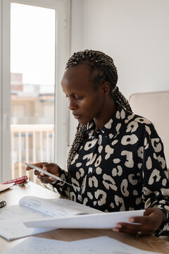 Pilot student using slide rule device and weather charts