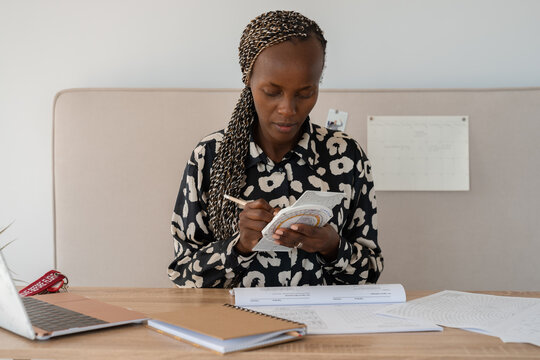Aviation school student learning to use slide rule device